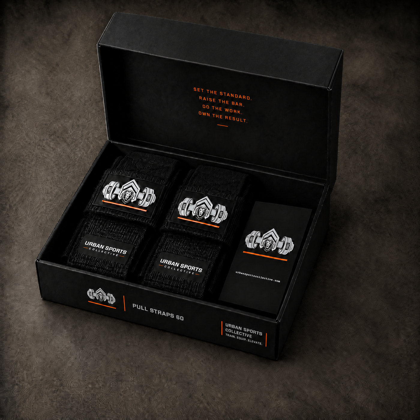 Open lifting-strap box with the pair and instruction card inside